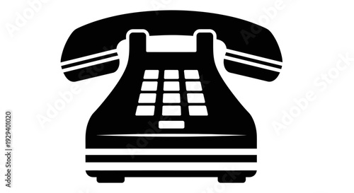 Vintage black rotary telephone with keypad and receiver.