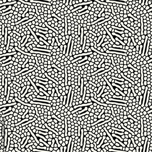 Vector seamless pattern. Free form organic shapes. Stylish structure of natural spots. Hand drawn abstract background. Can be used as swatch in Illustrator. Monochrome confused print.