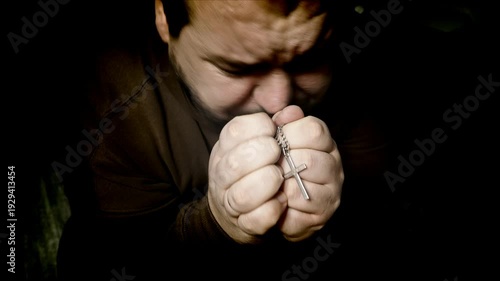 Hope for a miracle. A man prays.