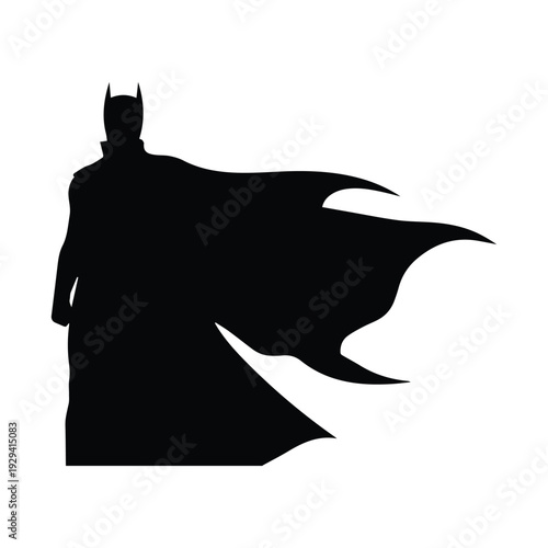 Batman standing heroically in iconic cape and mask