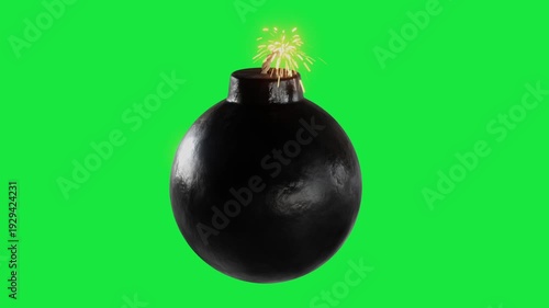 Black round bomb with lit fuse spark isolated on green screen background