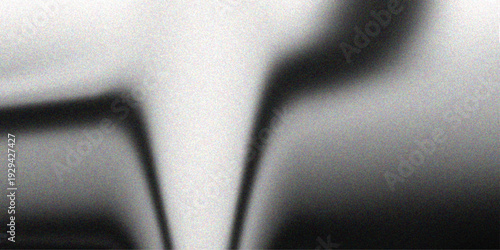 A hand holding a key moves toward a black electric switch and plug on a modern car dashboard featuring high-tech auto interior control equipment