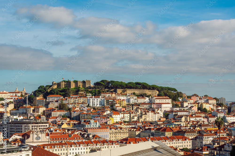 Fototapeta premium Elevated View of São Jorge Castle and the Historic Alfama District in Lisbon, Portugal