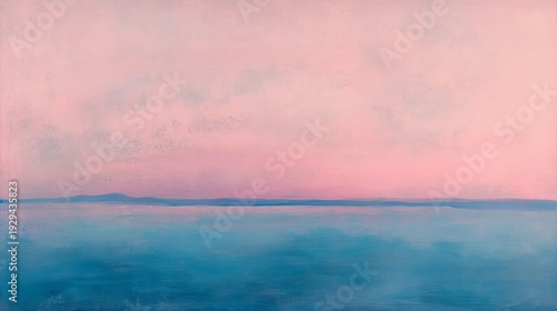 Serene pink and blue sunset over calm water landscape
