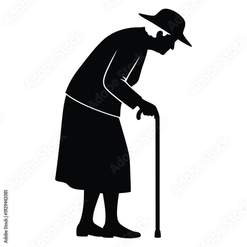 Elderly woman walking with cane in silhouette