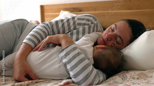 фотографія Restful nap shared by mother and baby, highlighting emotional connection, nurtur