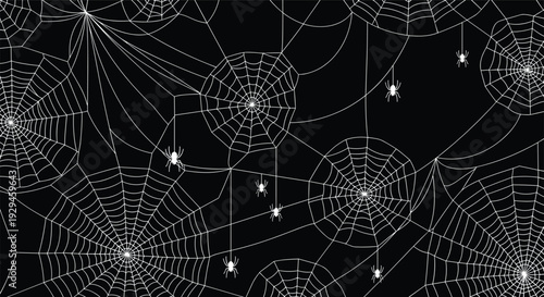Spooky seamless Halloween pattern of intricate white spiderwebs and hanging spiders on a contrasting solid black background.