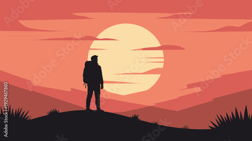 A silhouette of a person standing on a hill watching a vibrant sunset