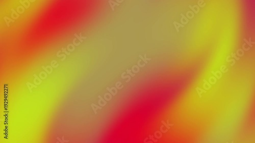 Blurred background of red, yellow, and brown hues. Suitable for fall themed designs, web banners, or warm color palettes inspiration.