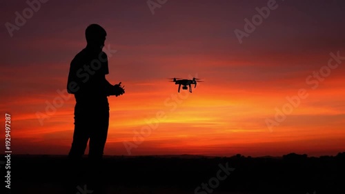 Drone Operator Silhouette at Sunset – Technology Meets Nature