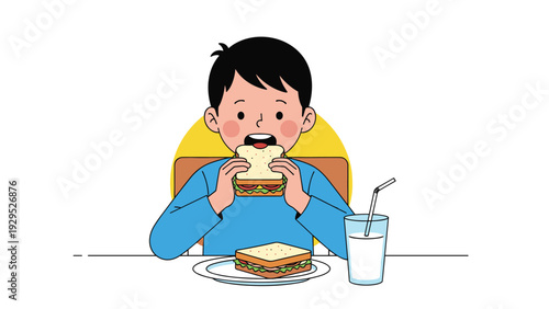 Happy young boy enjoys eating a healthy sandwich while sitting at a table with a glass of milk for lunch at home.