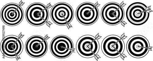 Silhouette of targets with arrows in a bullseye shooting range