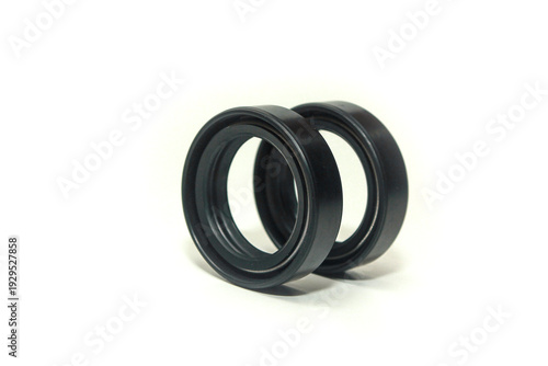 Photography rubber oil seals featuring a garter spring designed to maintain constant pressure on the rotating shaft