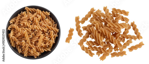 Wolegrain fusilli pasta from durum wheat in ceramic bowl isolated on white background. Top view. Flat lay.