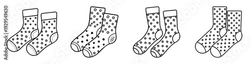 Four pairs of polka dot socks illustrated in a black and white drawing