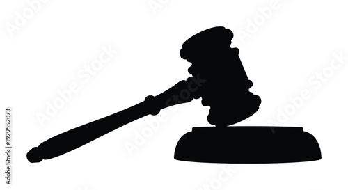 A stark black silhouette of a traditional gavel resting on a sound block representing legal authority and justice silhouette