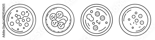 Four distinct Petri dishes showing cell cultures with varying growth patterns
