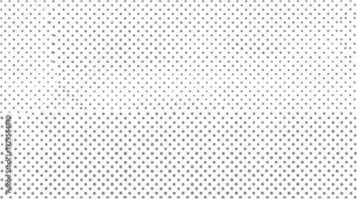 Gray polka dots pattern with gradient density on a white background