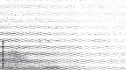 Gray dots pattern with varying density and size on a white background
