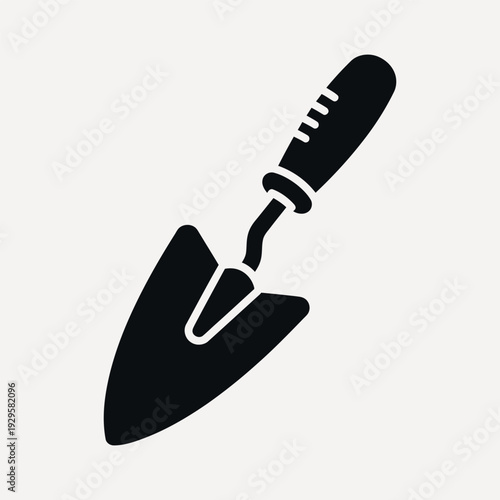 Black silhouette of a garden trowel with a textured handle on a light grey background tool