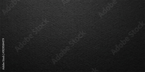 Dark textured black leather fabric background with a macro pattern of rough natural material skin for an old textile wallpaper design