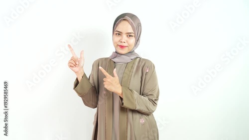 Muslim Woman with Friendly Expression and Pointing Right and Left Gesture Isolated on White Background in 4k Resolution