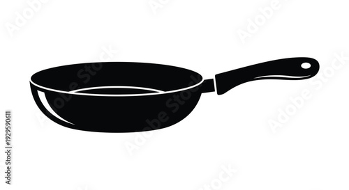 A stark black silhouette of a frying pan against a white background emphasizing simple kitchen cookware silhouette high quality