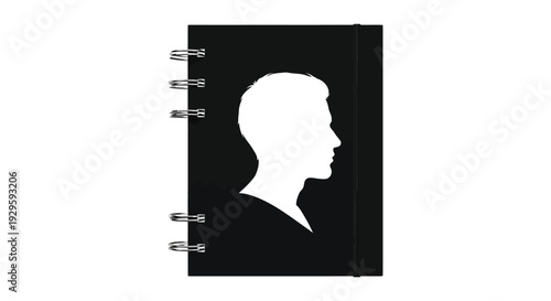 A black notebook features a striking white silhouette of a man s profile on its cover a minimalist design silhouette