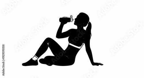 Silhouette of a woman in athletic wear drinking from a bottle