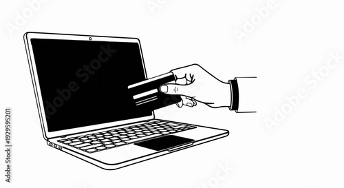 Hand inserting a credit card into a laptop for online payment