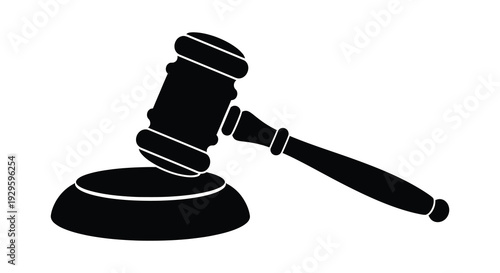 A stark black silhouette of a gavel resting on a sound block symbolizing justice and legal proceedings silhouette