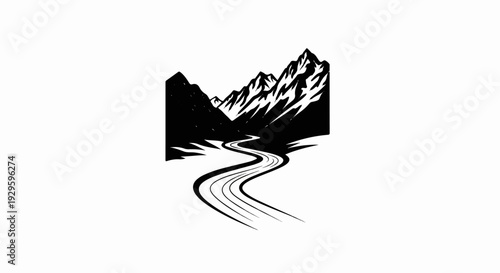 A winding road curves through a mountainous landscape with jagged peaks