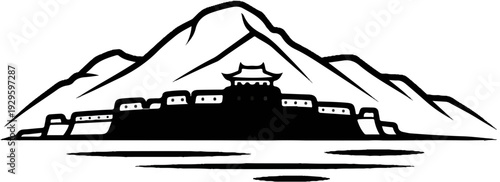 Ancient fortified settlement nestled against a majestic mountain range