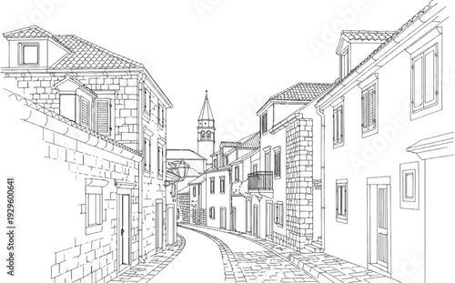 Narrow cobblestone street lined with old stone buildings and a distant church tower