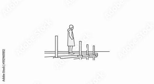 Person in long coat stands on pier with posts, looking out