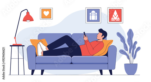 Young man relaxing on a blue sofa while browsing on his smartphone in a cozy living room decorated with frames and plants.