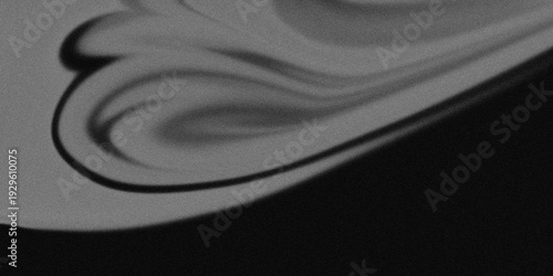 Abstract black and white swirling patterns on a dark background