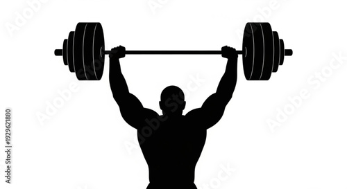 Muscular man lifting heavy barbell overhead with determination