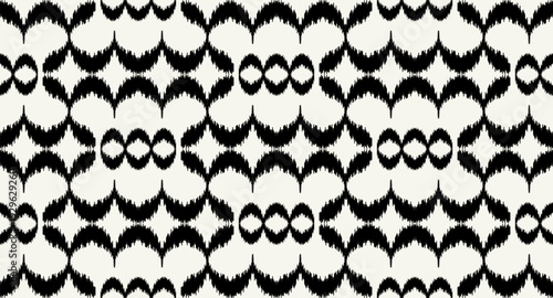 Black Ikat Wave Seamless Pattern on Neutral Background.Abstract Tribal Brushstroke Textile Design.Boho Geometric Wave All Over Print.Ethnic Ikat Seamless Wallpaper Pattern.Bohemian Surface Design.
