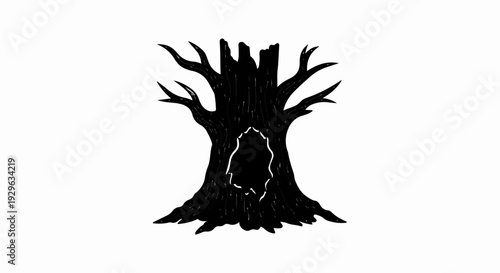 A stark, silhouetted, dead tree with a hollow in its trunk and broken branches