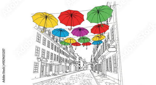 Colorful umbrellas strung above a cobblestone street lined with old buildings