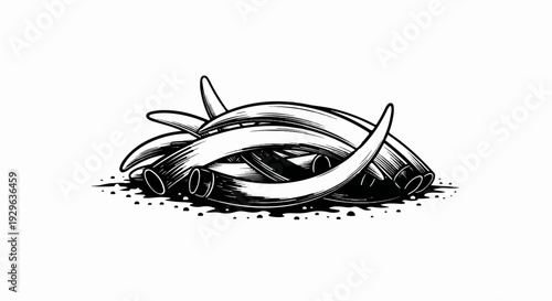 Heap of curved tusks and curved ivory pieces on a dotted surface