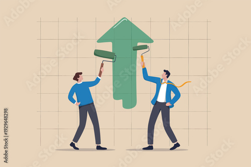 Business people painting a large green upward arrow representing growth and success together.