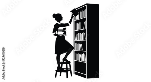 Silhouette of a woman reaching for a book on a tall shelf while holding a stack