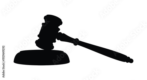 A stark black silhouette of a traditional gavel and sound block represents legal authority and justice silhouette high quality