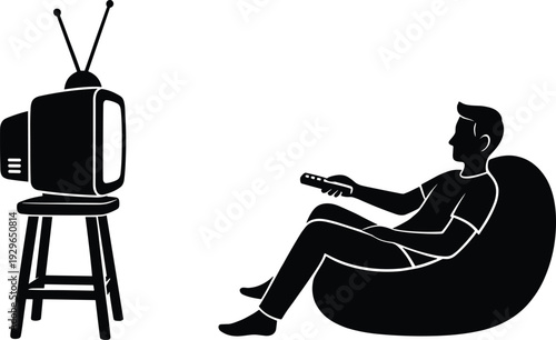 Black silhouette of a man relaxing in a bean bag chair and watching a vintage retro television with a remote.