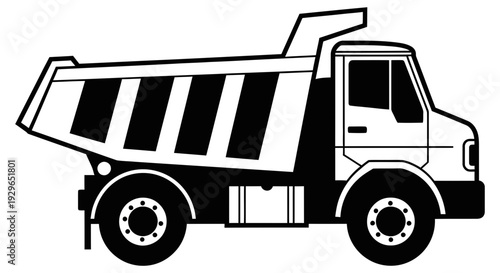 Heavy dump truck with large container for transporting materials and construction equipment on roadways