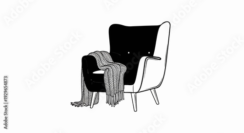 Black armchair with a textured blanket draped over the seat and armrest