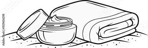 A jar of cream and a folded towel rest on a textured surface