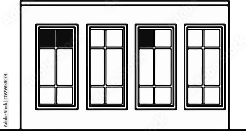 Four windows in a building, two with partially shaded top panes